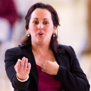 teacher conducting students